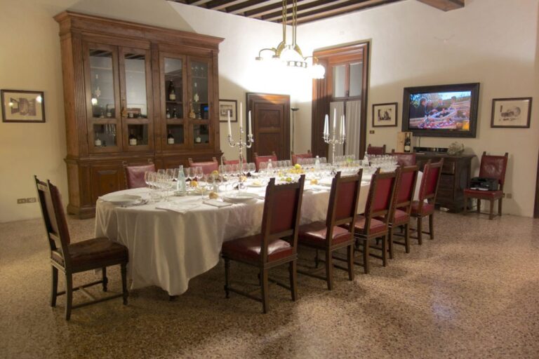 A dinner table in a historic room, Villa Mosconi Bertani