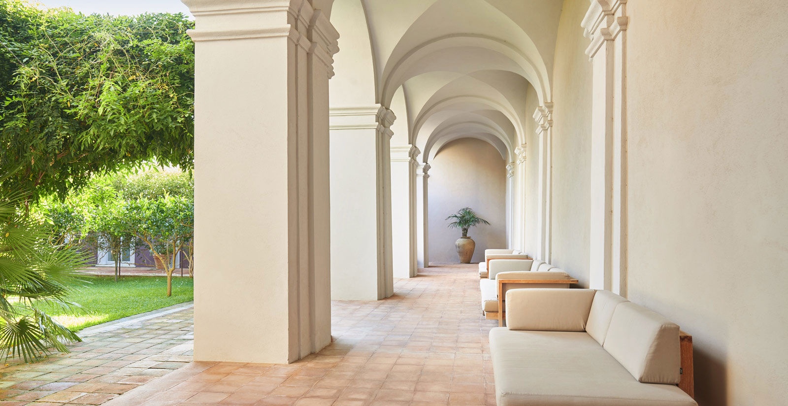 The whitewashed cloister colonnade of the former convent, Villa Paola