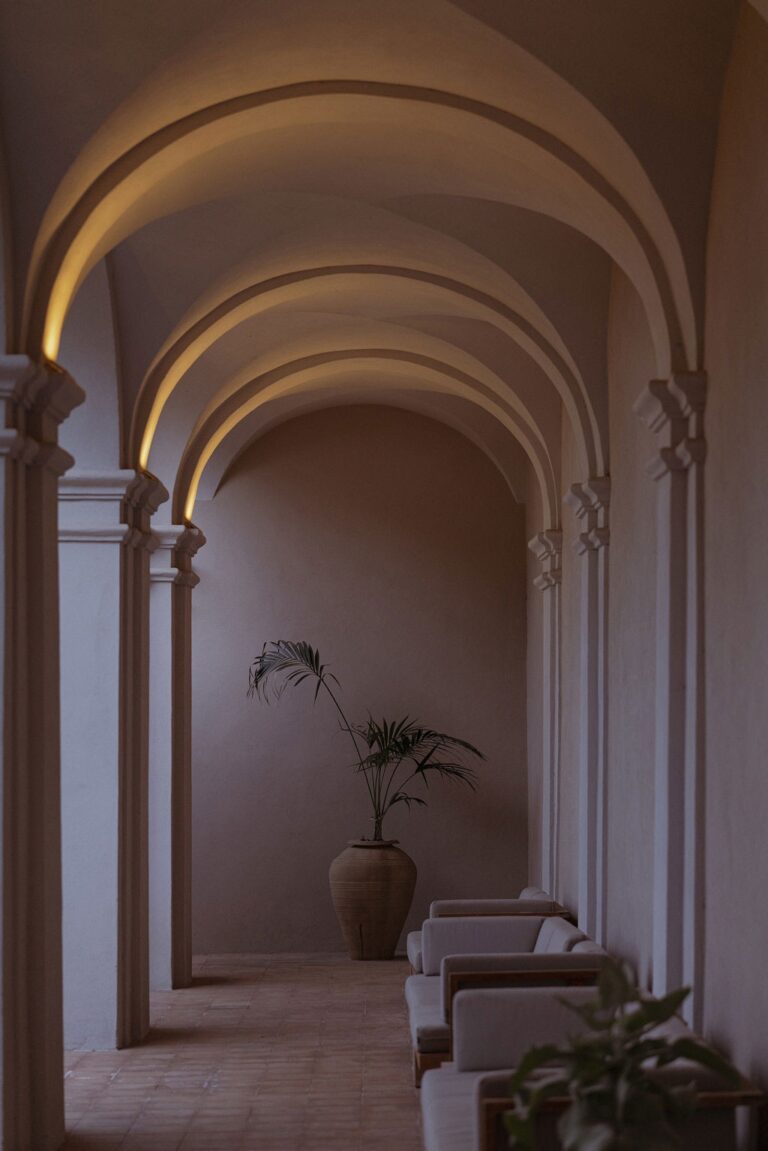 A white vaulted corridor of the former convent, Villa Paola