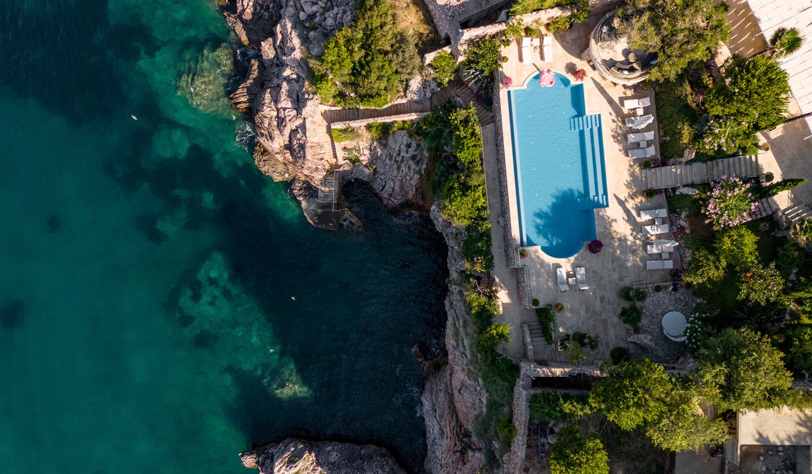 Aerial view of the villa pool above the cliff and sea, Villa Ponta Melagrana