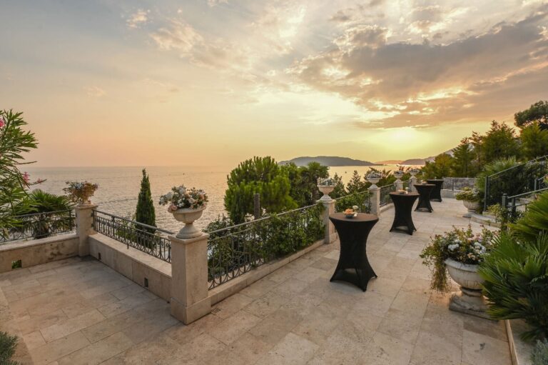 Cocktail tables on the terrace at sunset, Villa Ponta Melagrana