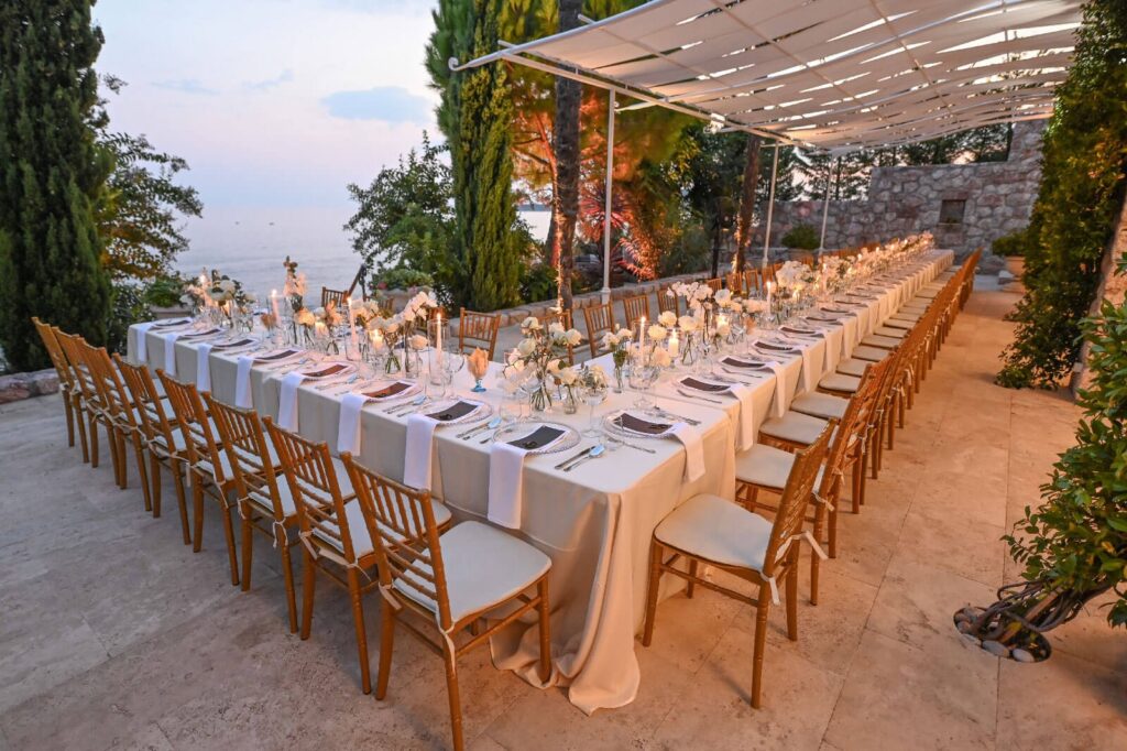 A long table set on the terrace under a canopy, Villa Ponta Melagrana