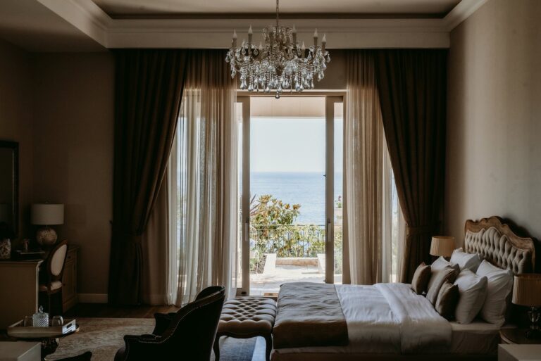 A bedroom with a terrace door to the sea, Villa Ponta Melagrana