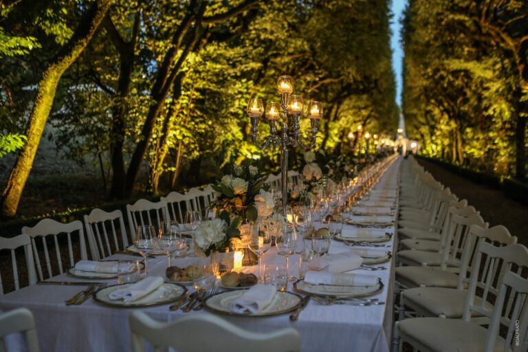 An evening banquet table beneath the trees, Villa Rizzardi
