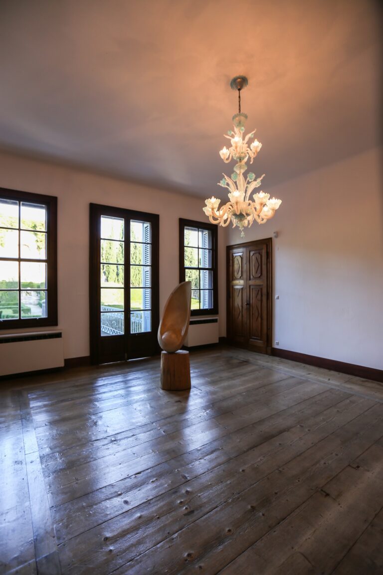 A large room with a wooden floor and chandelier, Villa Rizzardi