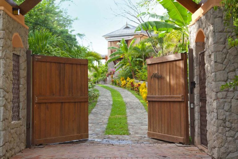 The wooden gates and stone entrance to the villa grounds, Villa Susanna St Lucia