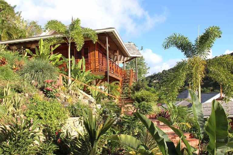 A timber cottage among the villa's tropical gardens, Villa Susanna St Lucia
