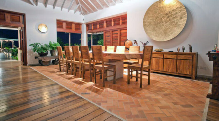 The dining room with its long table and timber floor, Villa Susanna St Lucia