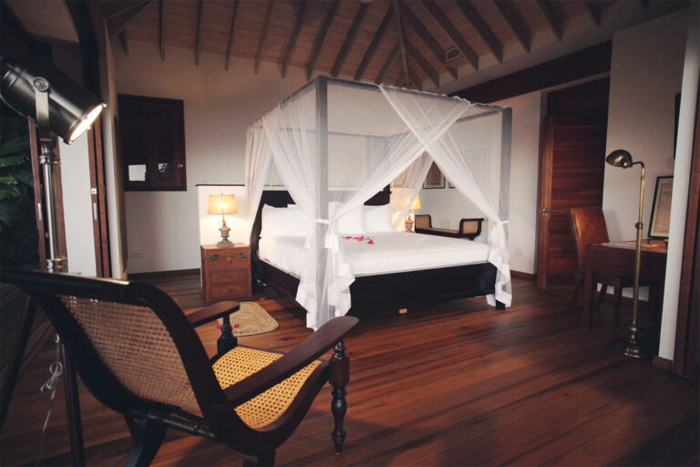 The Red Heliconia king bedroom with a four-poster bed and netting, Villa Susanna St Lucia