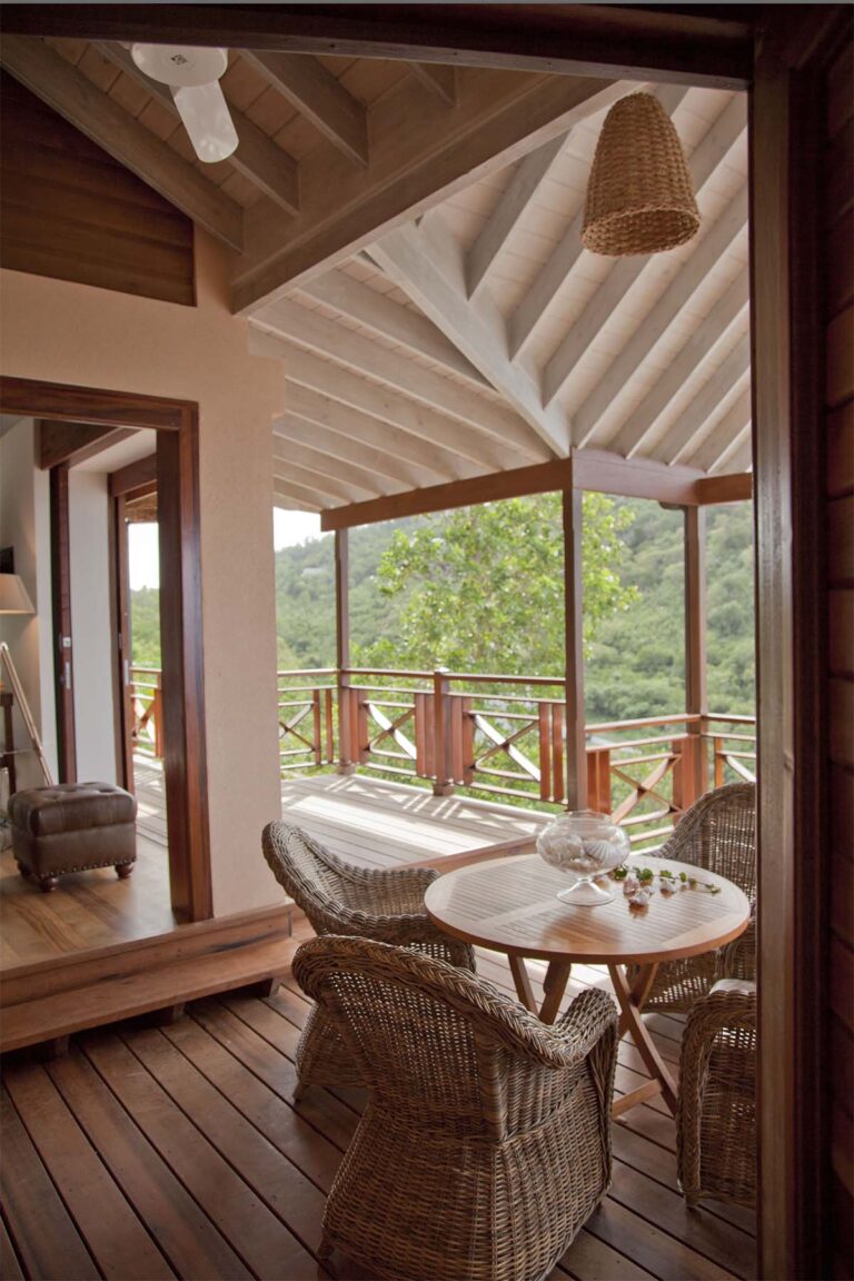 The Red Heliconia veranda with a table and wicker chairs, Villa Susanna St Lucia