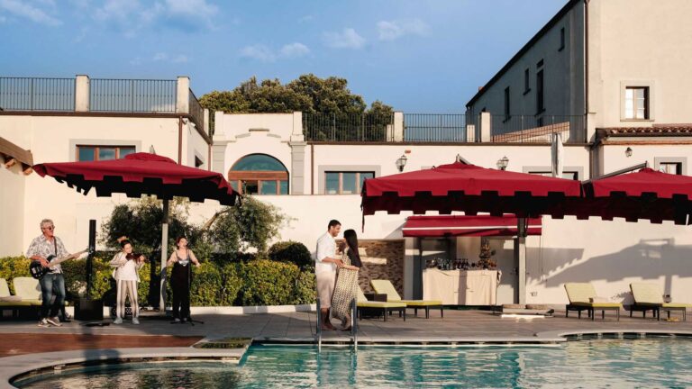 The pool and the red parasols, Villa Tolomei Hotel