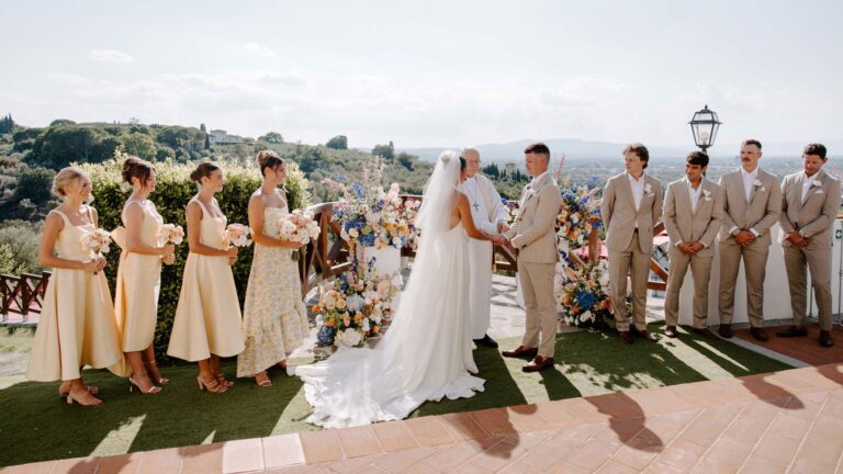 A wedding ceremony on the terrace with the city behind, Villa Tolomei Hotel
