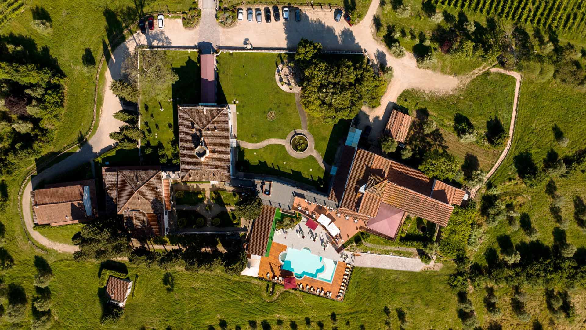 The villa, its gardens and pool from above, Villa Tolomei Hotel