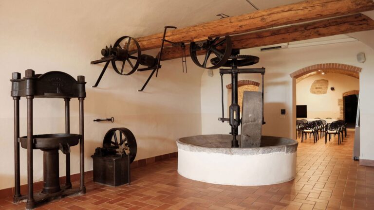 The ancient oil mill with its stone press, Villa Tolomei Hotel
