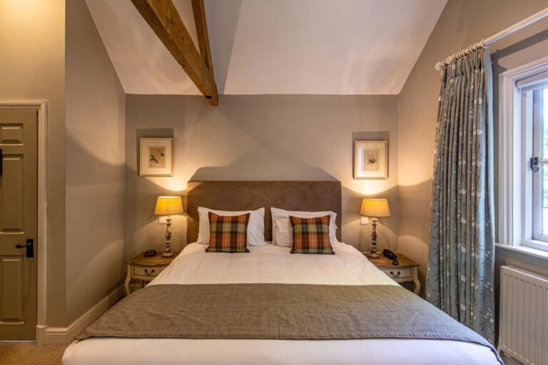 A room with a fireplace at the Five Arrows, Waddesdon Manor