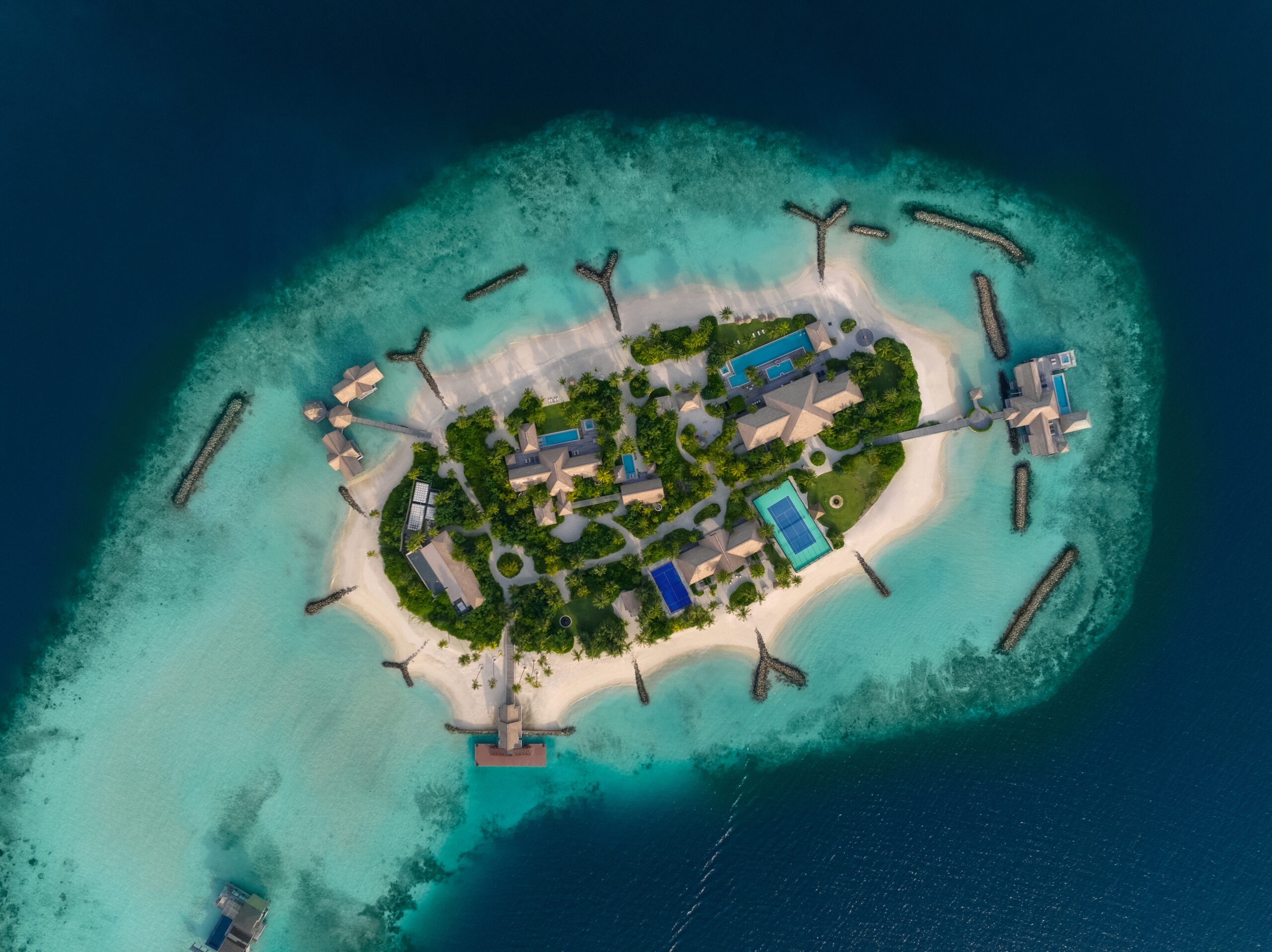 Aerial view of an island ringed by reef and white sand, Waldorf Astoria Maldives Ithaafushi