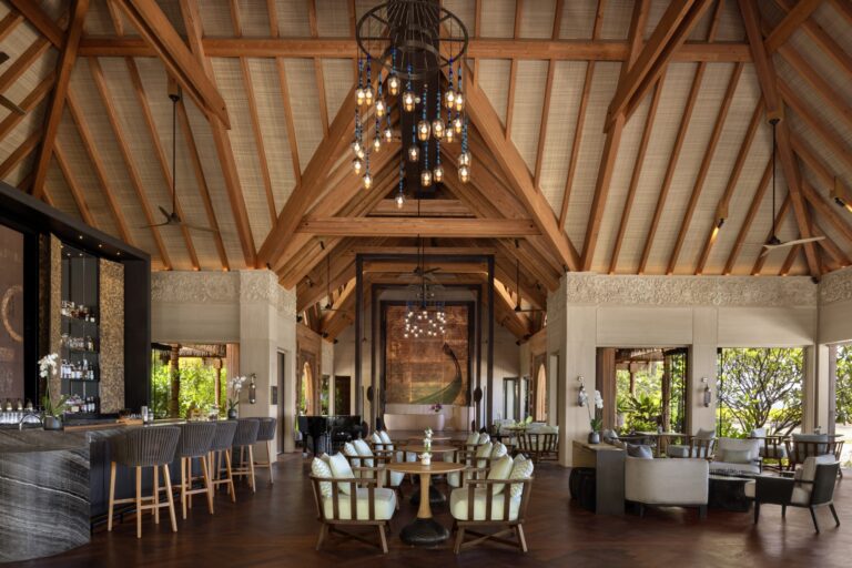 The open-air lounge with its timbered roof and bar, Waldorf Astoria Maldives Ithaafushi
