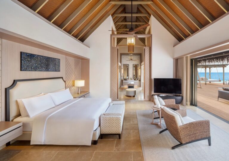 A villa bedroom with a sea view, Waldorf Astoria Maldives Ithaafushi
