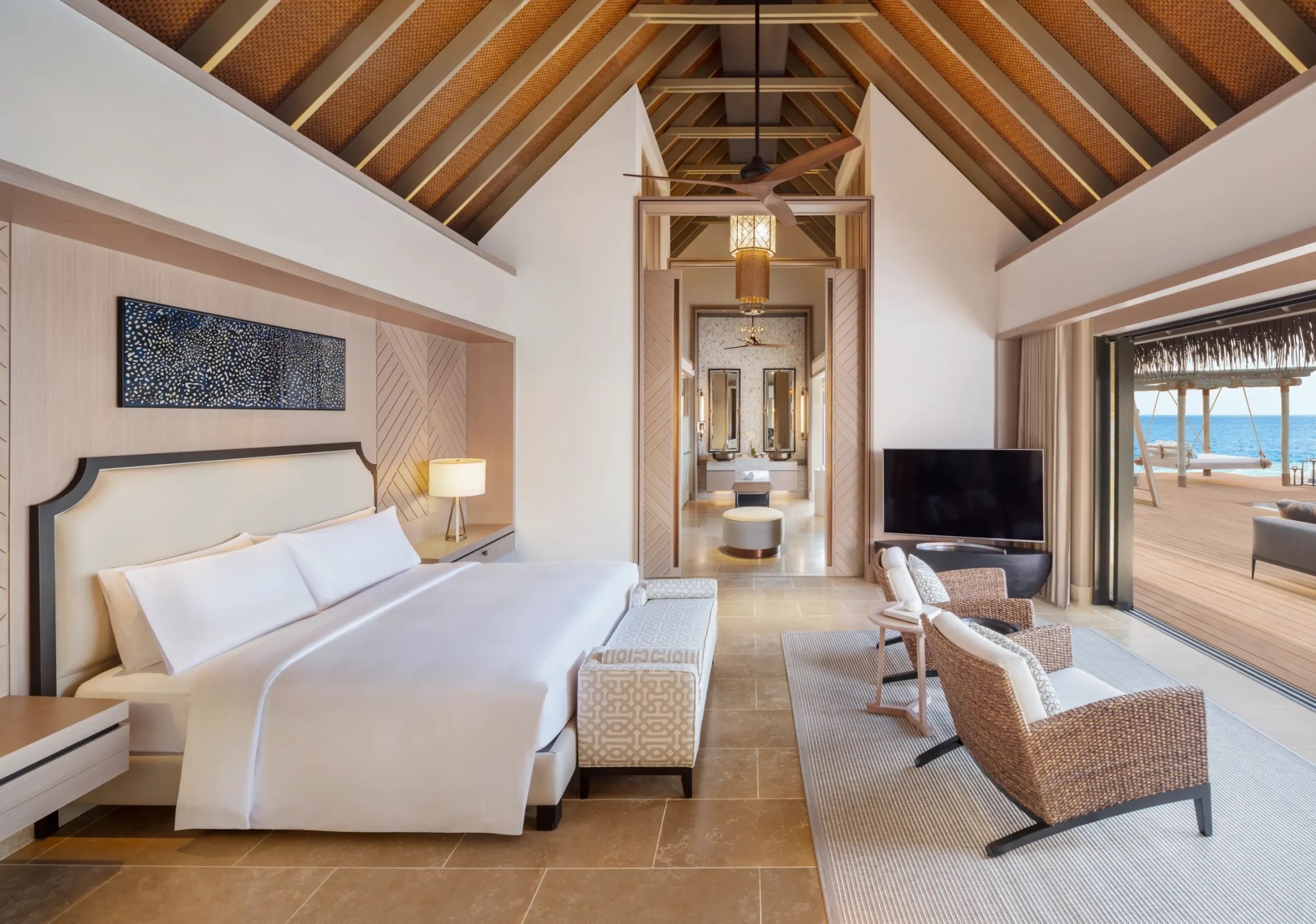 A villa bedroom with a sea view, Waldorf Astoria Maldives Ithaafushi