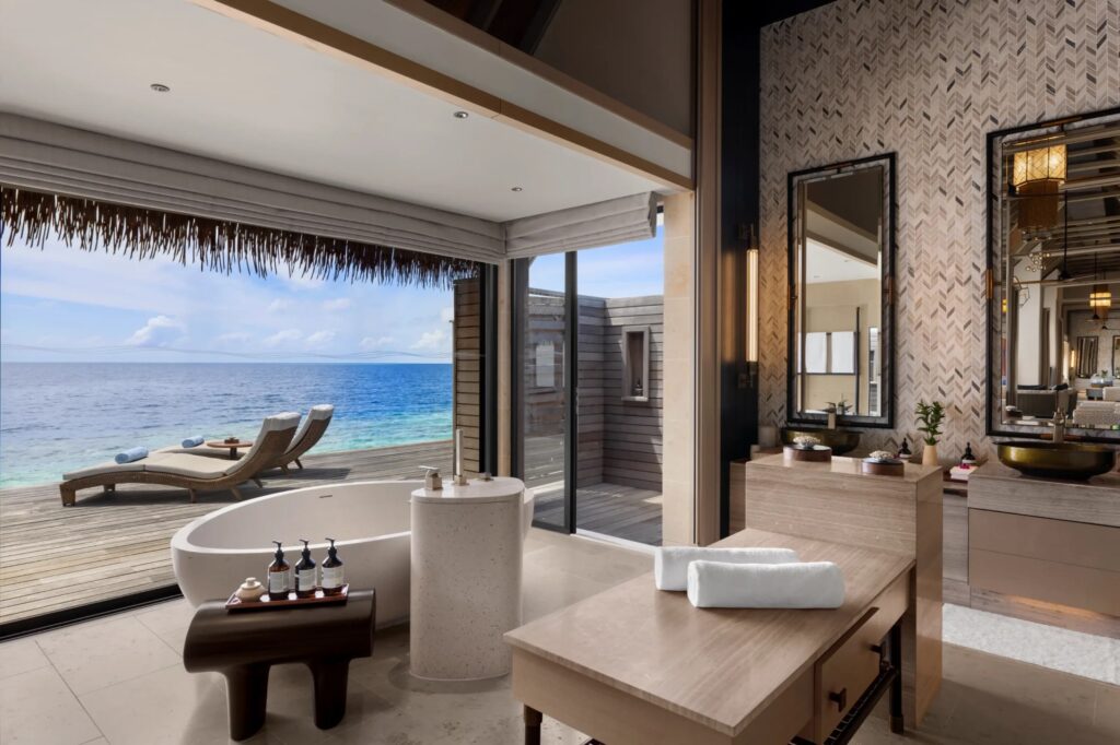 A villa bathroom open to the sea, Waldorf Astoria Maldives Ithaafushi
