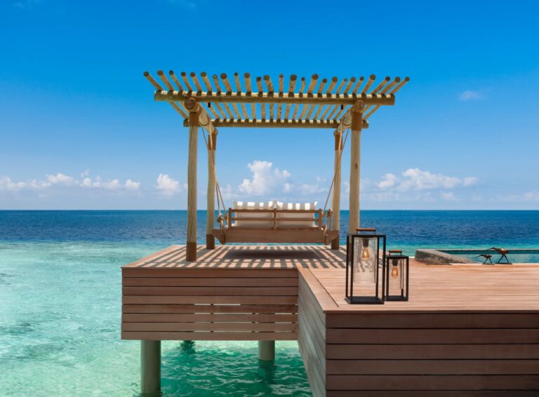 A daybed on an overwater deck, Waldorf Astoria Maldives Ithaafushi