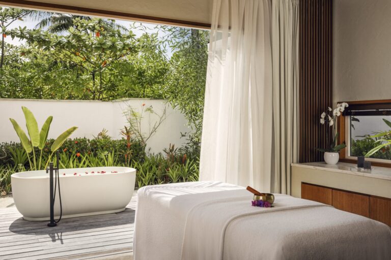 A spa treatment room opening to a garden, Waldorf Astoria Maldives Ithaafushi