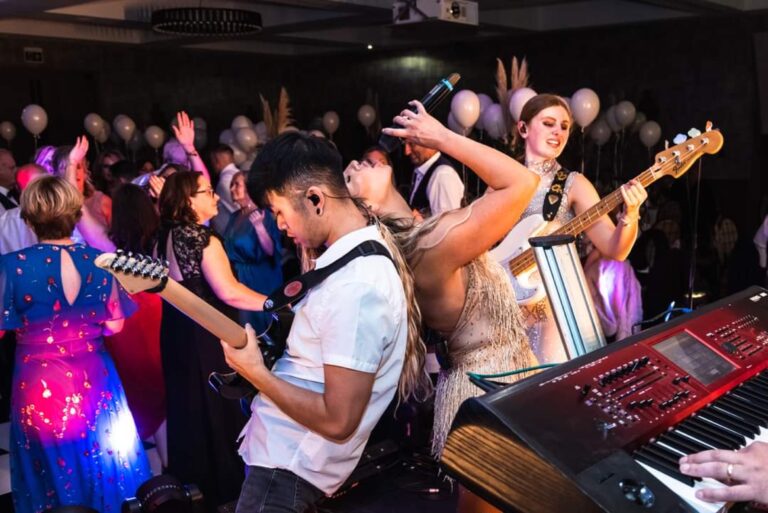 Guests dancing beside the guitarist and keyboard player, Waterfront