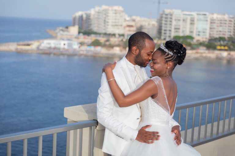 Couple on a seafront balcony, Malta, Wed In Malta