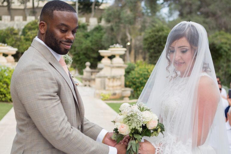 Groom and veiled bride in a terraced Maltese garden, Wed In Malta