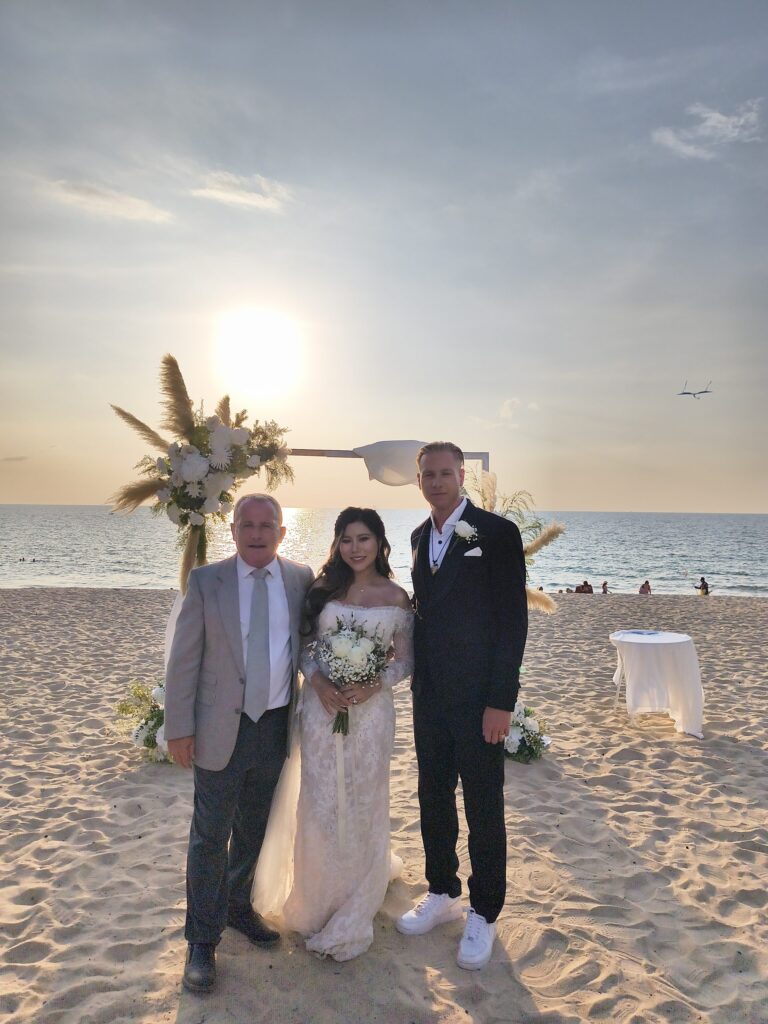 Sunset beach ceremony under a pampas grass arch, Bang Tao, Wedding Celebrant Phuket - Paul Cunliffe