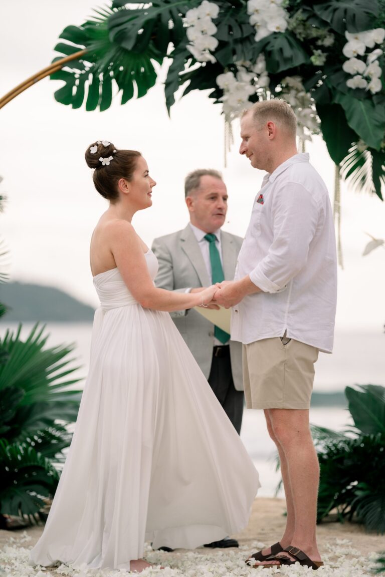 Vows at Thavorn Beach Village framed by tropical foliage and orchids, Wedding Celebrant Phuket - Paul Cunliffe