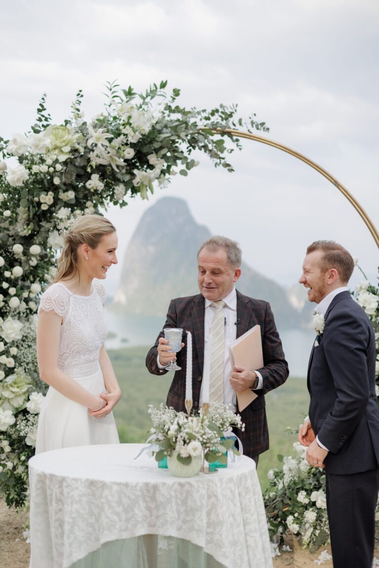 White floral ring arch ceremony with limestone karst behind, Phang Nga, Wedding Celebrant Phuket - Paul Cunliffe