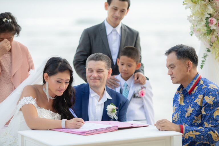 Marriage register signing at the end of a beach ceremony, Thavorn Beach Village, Wedding Celebrant Phuket - Paul Cunliffe