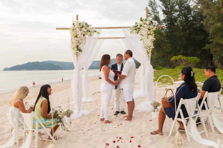 Beach ceremony with white drapes and scattered petals, Phuket, Wedding Celebrant Phuket - Paul Cunliffe