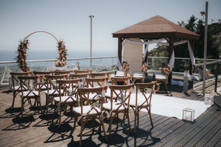 Ceremony chairs and a floral hoop arch on the Oceania terrace, Wedding Cyprus Villas
