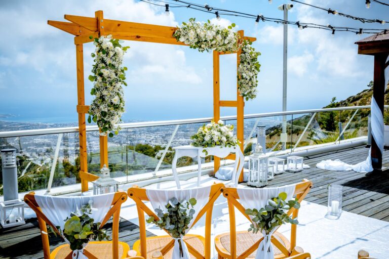 A floral arch and aisle on the Oceania roof terrace, Wedding Cyprus Villas