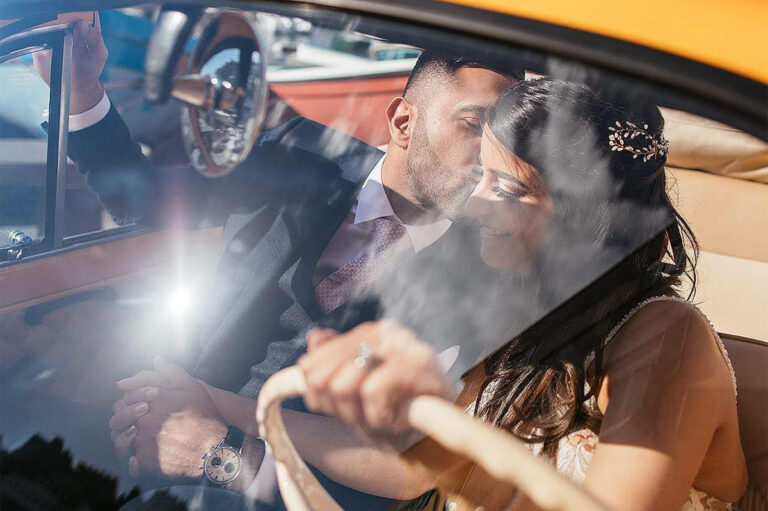 Couple kissing in the front seats of the Fiat 500, Wedding In Yellow Vintage