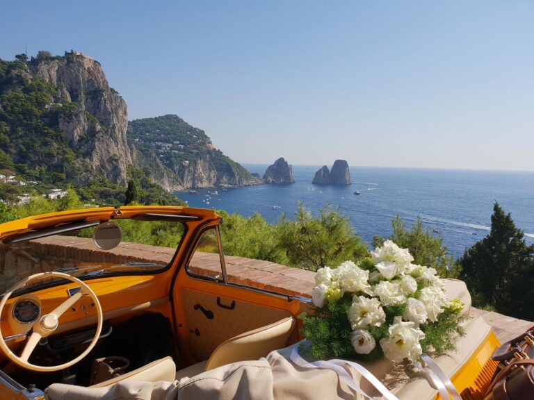 Fiat 500 with white flowers above the Faraglioni, Capri, Wedding In Yellow Vintage