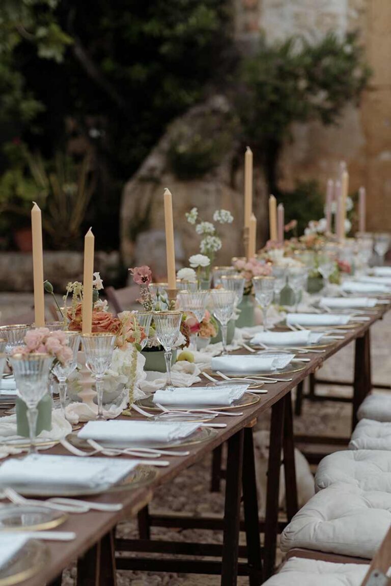 Long table with taper candles and pastel flowers, Wedding Sicily