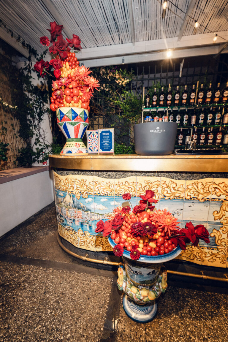 A bar faced in painted majolica panels, with urns of red dahlias and tomatoes, Capri, Weddings Amalfi