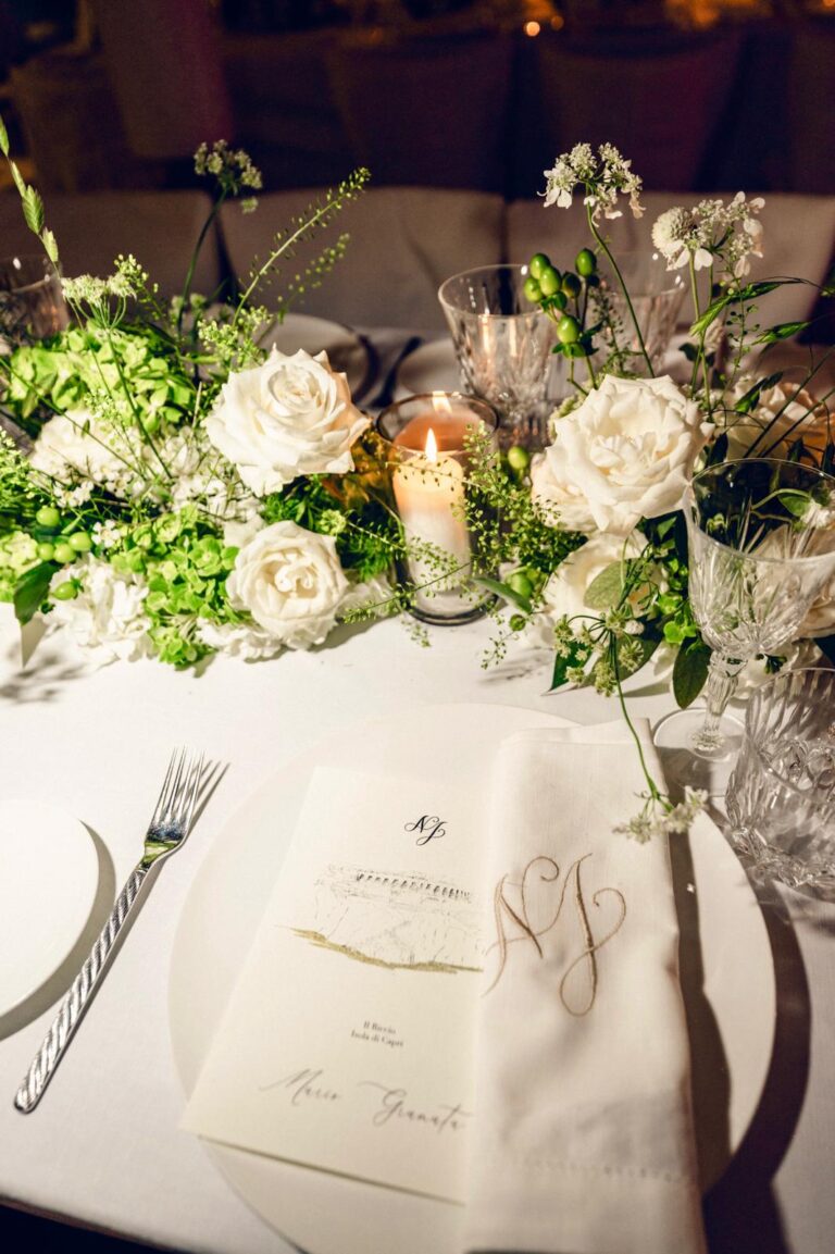 White roses, greenery and candlelight around a place setting with a calligraphy menu, Capri, Weddings Amalfi
