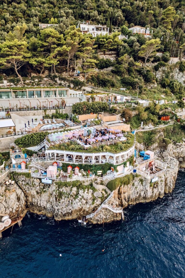 A clifftop terrace set for a party on Capri, seen from the air above the sea, Weddings Amalfi