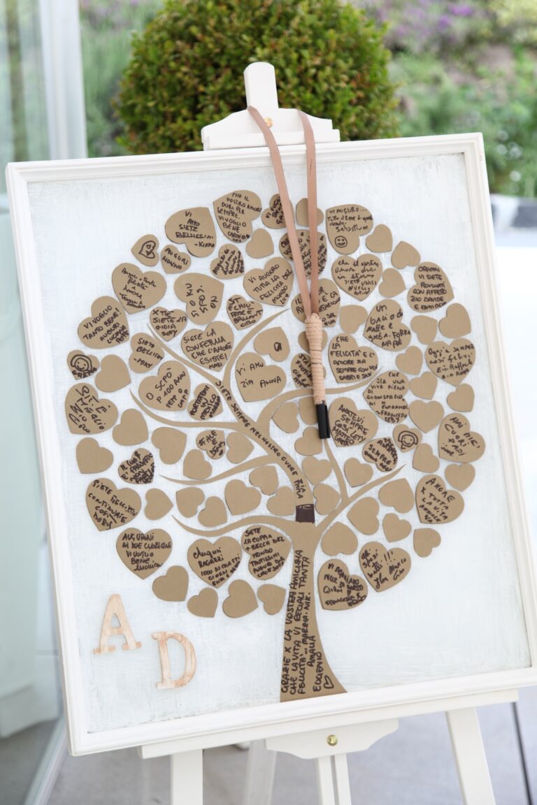 A guest book in the form of a tree of paper hearts signed by the guests, on an easel, WEM Eventi
