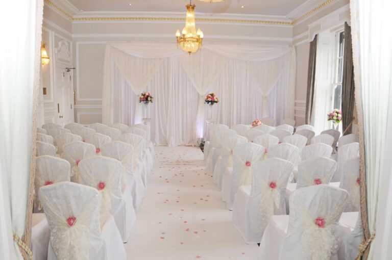Ceremony room dressed in white with an aisle runner, West Lodge Park