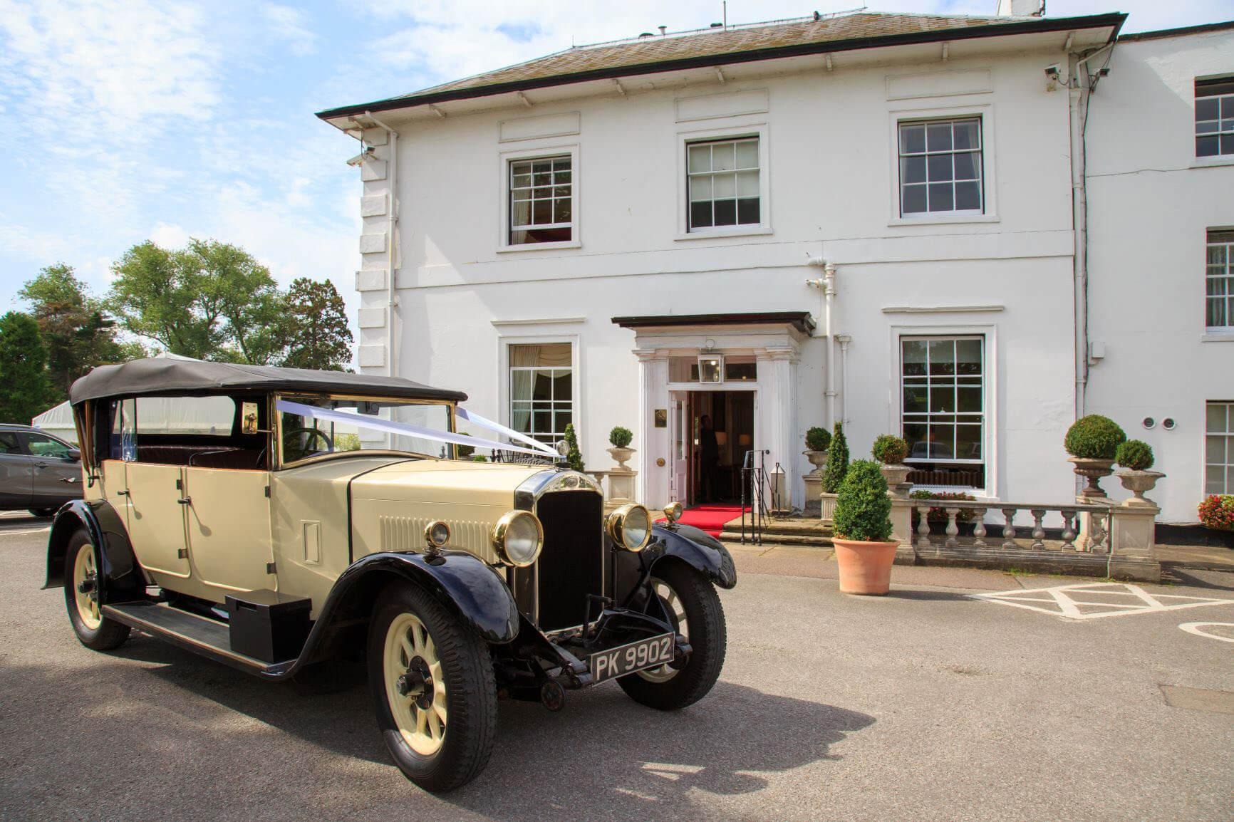 The house and its entrance with a vintage wedding car, West Lodge Park