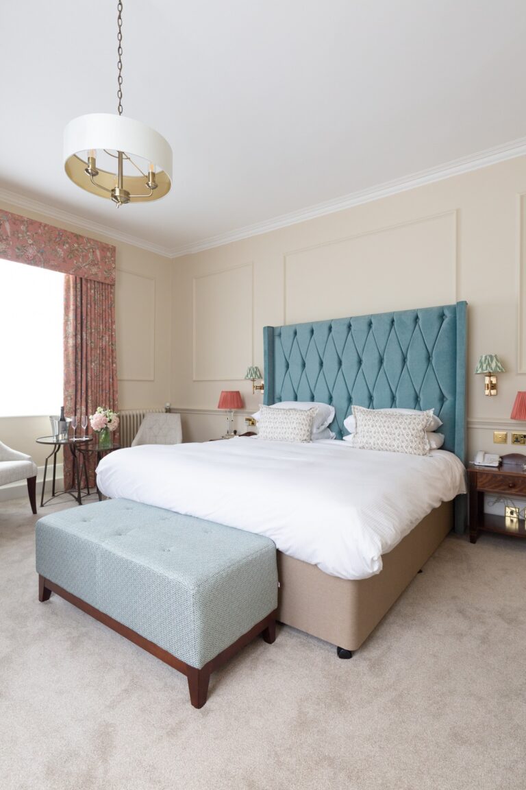 Bedroom with a blue upholstered headboard, West Lodge Park