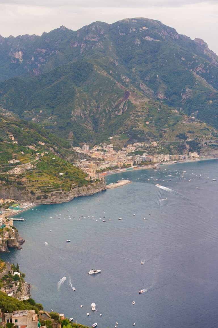 Aerial: the Amalfi coastline, terraced groves above a working harbour, White Emotion