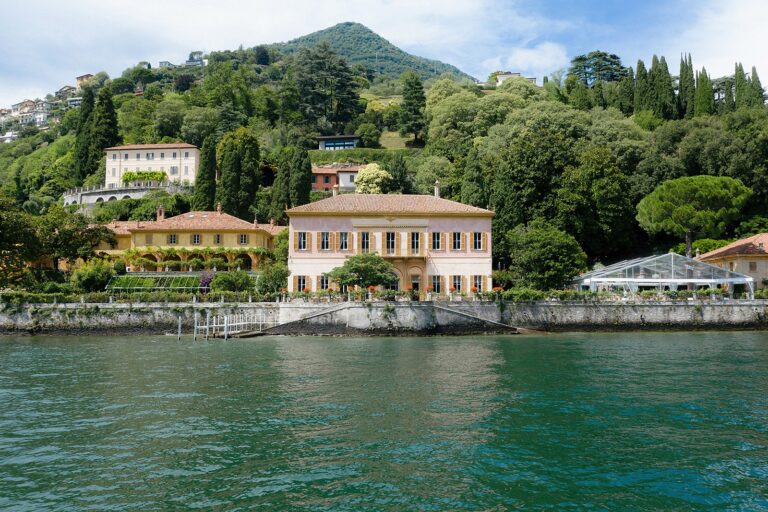 Villa Pizzo seen from the water, a clear-roofed marquee dressed on its lakeside lawn, White Emotion
