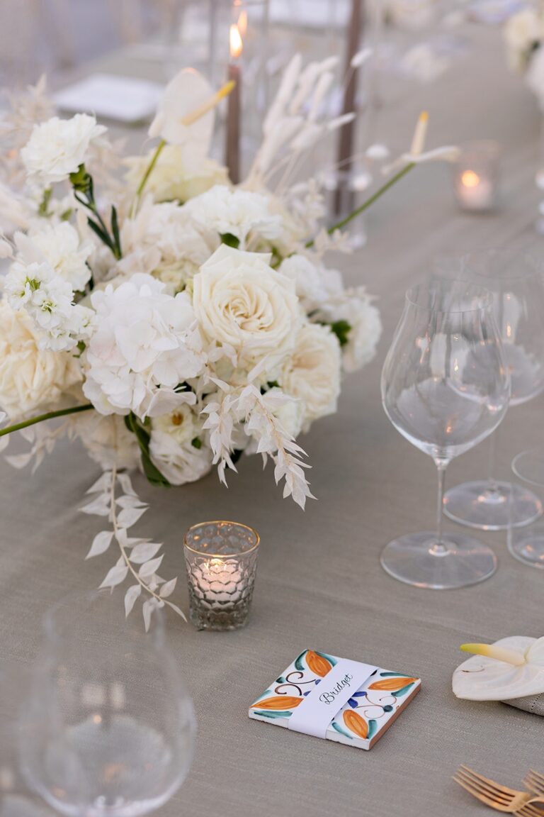 A table setting with a hand-painted Sicilian ceramic place card, White Emotion