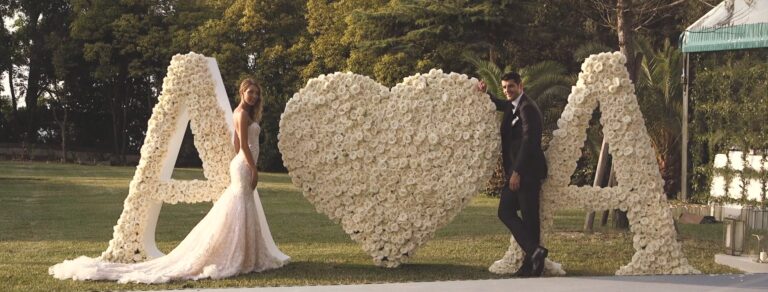 Alvaro Morata and Alice Campello beside their floral initials, from the film of their Venice wedding, Whitesfilm Wedding Videography